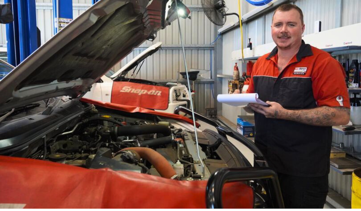 Mechanic working on car service for RoadPulse Automotive